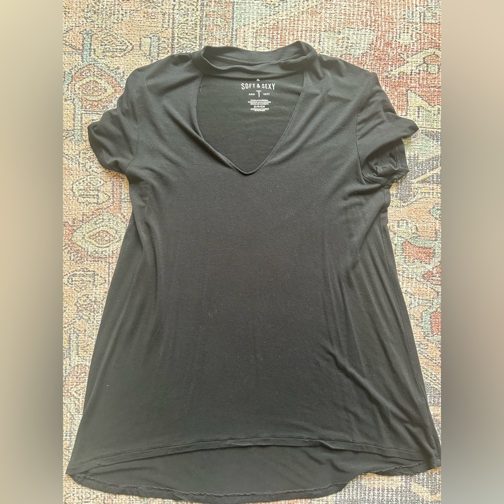 Small soft and sexy short sleeve top. Cut out in front with strap